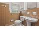 Bathroom has colorful tile, a single sink vanity, and a large window for natural light at 4606 Greensprings Rd, College Park, GA 30337