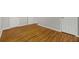 Spacious bedroom featuring gleaming hardwood floors and multiple closets for ample storage at 4606 Greensprings Rd, College Park, GA 30337