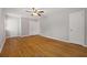Spacious bedroom featuring hardwood floors, neutral walls, and plenty of closet space at 4606 Greensprings Rd, College Park, GA 30337