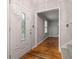 Bright foyer showcases hardwood floors and an elegant front door with decorative glass at 4606 Greensprings Rd, College Park, GA 30337