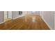 Open living room features gleaming hardwood floors and neutral paint, offering a versatile living space at 4606 Greensprings Rd, College Park, GA 30337