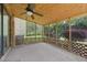 Covered screened porch with ceiling fan and lattice detail provides the perfect outdoor retreat at 4606 Greensprings Rd, College Park, GA 30337