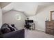 Versatile attic space with a round window, comfortable seating, and a built-in dresser at 5296 Camden Lake Nw Pkwy, Acworth, GA 30101
