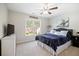 Comfortable bedroom with a TV, view of the neighborhood, and soft, welcoming textures at 5296 Camden Lake Nw Pkwy, Acworth, GA 30101