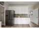 Updated kitchen featuring stainless steel appliances, granite countertops, and ample cabinet space at 5296 Camden Lake Nw Pkwy, Acworth, GA 30101