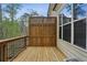 Outdoor deck with privacy screen, offering a serene view of surrounding trees at 828 Canterbury Overlook Ne, Atlanta, GA 30324