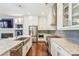 Modern kitchen with stainless steel appliances, stone countertops, and white cabinets at 828 Canterbury Overlook Ne, Atlanta, GA 30324