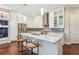 Eat-in kitchen boasts granite counters, white cabinets, and stainless steel appliances at 828 Canterbury Overlook Ne, Atlanta, GA 30324