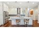 Beautiful kitchen with stainless appliances, white cabinets, and hardwood floors at 828 Canterbury Overlook Ne, Atlanta, GA 30324