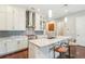 Spacious kitchen featuring granite countertops, stainless steel appliances, and a central island with seating at 828 Canterbury Overlook Ne, Atlanta, GA 30324