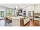 Open floor plan featuring kitchen, living room, hardwood floors, and abundant natural light at 828 Canterbury Overlook Ne, Atlanta, GA 30324