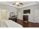 Main bedroom showcasing dark wood floors and featuring a ceiling fan at 828 Canterbury Overlook Ne, Atlanta, GA 30324