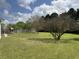 Expansive backyard featuring a play structure and a well-maintained lawn, offering ample space for recreation at 140 Grayview Ct, Grayson, GA 30017