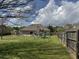 Wide-open backyard, featuring a playground, a wooden fence, and a grassy area, great for playing in a Gathering friendly yard at 140 Grayview Ct, Grayson, GA 30017