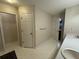 Bathroom featuring a double sink vanity and doors to the closet and shower at 140 Grayview Ct, Grayson, GA 30017