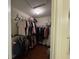 Walk-in closet with hanging clothes and plenty of storage space at 140 Grayview Ct, Grayson, GA 30017