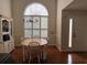 Dining room featuring hardwood floors, a hutch, and a large window, offering a cozy and inviting atmosphere at 140 Grayview Ct, Grayson, GA 30017