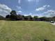 Spacious front yard with a lush lawn and a view of the home's exterior at 140 Grayview Ct, Grayson, GA 30017