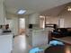 Open kitchen with white cabinets, breakfast bar and view to living room with lots of natural light at 140 Grayview Ct, Grayson, GA 30017