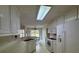 Functional kitchen featuring a white appliances, a window above the sink, and a view to the backyard at 140 Grayview Ct, Grayson, GA 30017