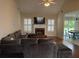 Spacious living room with vaulted ceilings, fireplace, wood floors and view to kitchen and dining area at 140 Grayview Ct, Grayson, GA 30017