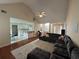 Living room showing open floor plan with views into kitchen and dining room, with vaulted ceilings and natural light at 140 Grayview Ct, Grayson, GA 30017