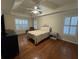 Main bedroom with neutral paint, plantation shutters, wood floors, and great natural light at 140 Grayview Ct, Grayson, GA 30017