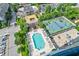 Stunning aerial view of a community featuring a pool, tennis court, and ample parking at 325 E Paces Ferry Ne Rd # 1405, Atlanta, GA 30305
