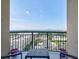 Cozy condo balcony overlooking the city skyline with comfortable outdoor seating and potted plants at 325 E Paces Ferry Ne Rd # 1405, Atlanta, GA 30305