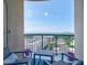 Comfortable balcony with city views from seating arrangement on a blue outdoor rug at 325 E Paces Ferry Ne Rd # 1405, Atlanta, GA 30305