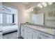 Bright bathroom with granite counters, double sinks, and an open bedroom view offers convenience and style at 325 E Paces Ferry Ne Rd # 1405, Atlanta, GA 30305
