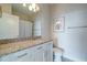Bright bathroom featuring modern granite countertops and white cabinetry at 325 E Paces Ferry Ne Rd # 1405, Atlanta, GA 30305