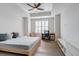 Bright bedroom features a ceiling fan, desk, and hardwood floors at 325 E Paces Ferry Ne Rd # 1405, Atlanta, GA 30305
