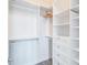 Organized walk-in closet featuring built-in shelving, drawers, and ample hanging space at 325 E Paces Ferry Ne Rd # 1405, Atlanta, GA 30305