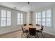 Bright dining area with seating for six, hardwood floors and a decorative pendant lamp at 325 E Paces Ferry Ne Rd # 1405, Atlanta, GA 30305
