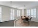 Open dining area with hardwood floors, white walls, shuttered windows, and pendant lighting at 325 E Paces Ferry Ne Rd # 1405, Atlanta, GA 30305