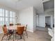 Inviting dining area with a round wooden table, seating for six, and natural light streaming through plantation shutters at 325 E Paces Ferry Ne Rd # 1405, Atlanta, GA 30305