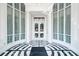 Bright building entrance with white pillars, marble floors, and expansive windows at 325 E Paces Ferry Ne Rd # 1405, Atlanta, GA 30305