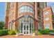 Beautiful building entrance with brickwork, glass doors, and decorative plants enhancing curb appeal at 325 E Paces Ferry Ne Rd # 1405, Atlanta, GA 30305