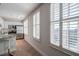 Bright kitchen featuring white cabinets, stainless appliances, large windows, and barstool seating at 325 E Paces Ferry Ne Rd # 1405, Atlanta, GA 30305