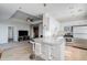 Modern kitchen featuring white cabinets, granite counters, stainless appliances, and barstool seating at 325 E Paces Ferry Ne Rd # 1405, Atlanta, GA 30305