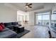Bright living room with a sectional sofa, and a balcony with a view at 325 E Paces Ferry Ne Rd # 1405, Atlanta, GA 30305