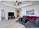 Spacious living room with hardwood floors, sectional sofa, and modern entertainment center at 325 E Paces Ferry Ne Rd # 1405, Atlanta, GA 30305