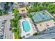 Overhead view of a community pool, tennis court, parking, and beautifully landscaped common area at 325 E Paces Ferry Ne Rd # 1405, Atlanta, GA 30305
