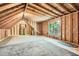 Unfinished attic space with exposed wood beams, a large window, and ample potential at 4225 Maner Se St, Smyrna, GA 30080