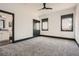 Neutral bedroom with dark trim, large windows, and an ensuite bathroom at 4225 Maner Se St, Smyrna, GA 30080