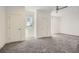Bright bedroom with neutral carpet, white walls, and natural light from the windows at 4225 Maner Se St, Smyrna, GA 30080