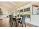 Open dining area with a view of the backyard, featuring a wooden dining table at 4225 Maner Se St, Smyrna, GA 30080