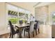 Bright dining room with a stone fireplace, large windows, and a wooden dining table at 4225 Maner Se St, Smyrna, GA 30080