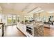 Open-concept kitchen featuring a large island, modern appliances, and seamless flow to living area at 4225 Maner Se St, Smyrna, GA 30080